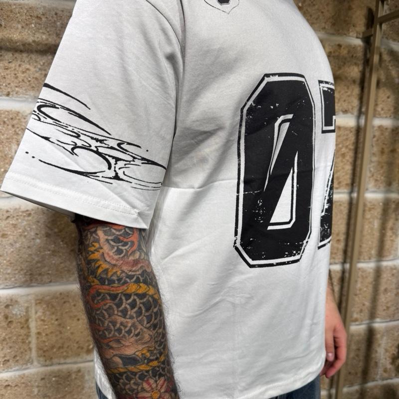 T-Shirt “07” oversize con stampa e abrasioni